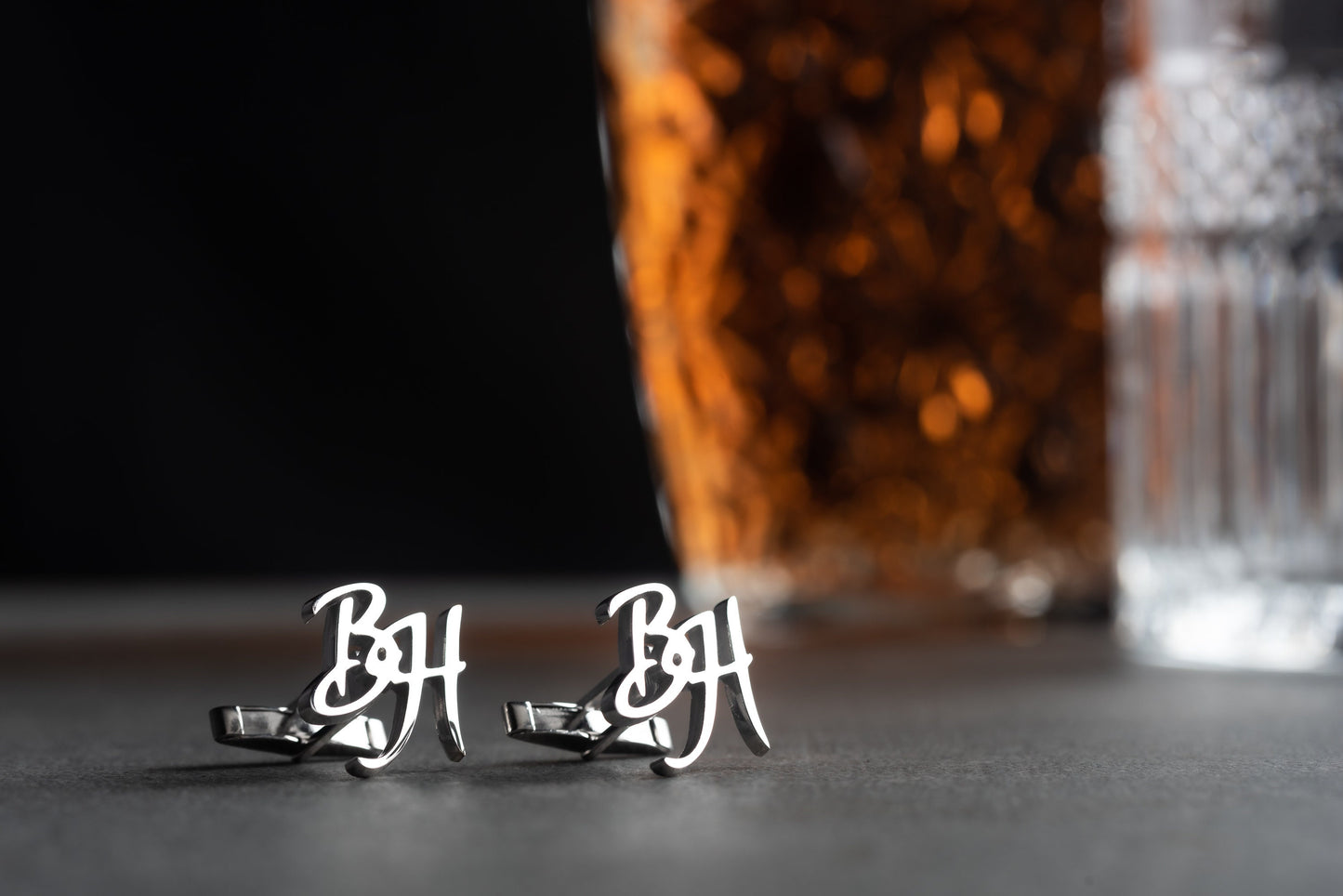 Detailed view of custom engraved initials on sterling silver cufflinks