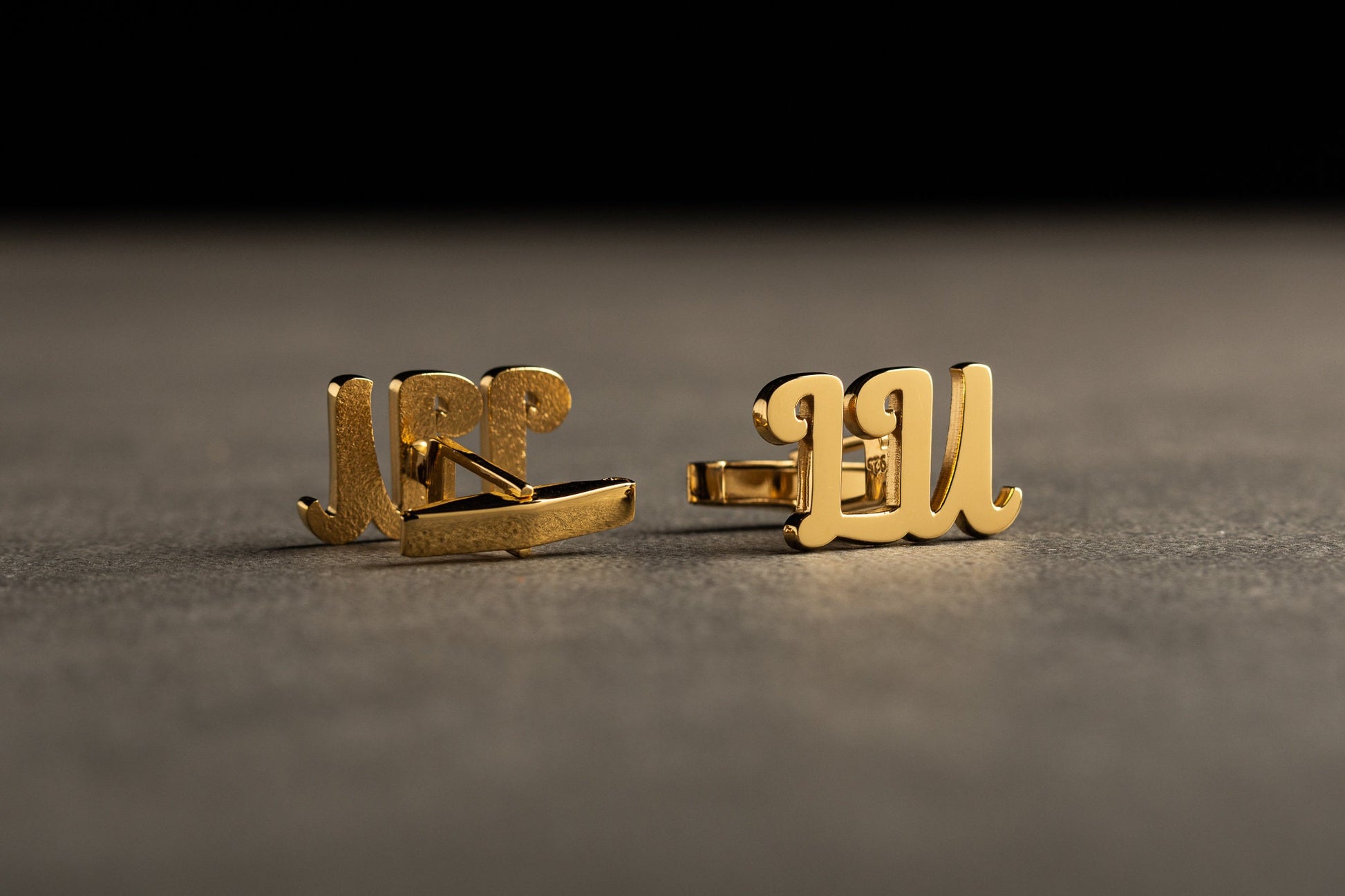 Close up of personalized 925 sterling silver horizontal initial cufflinks