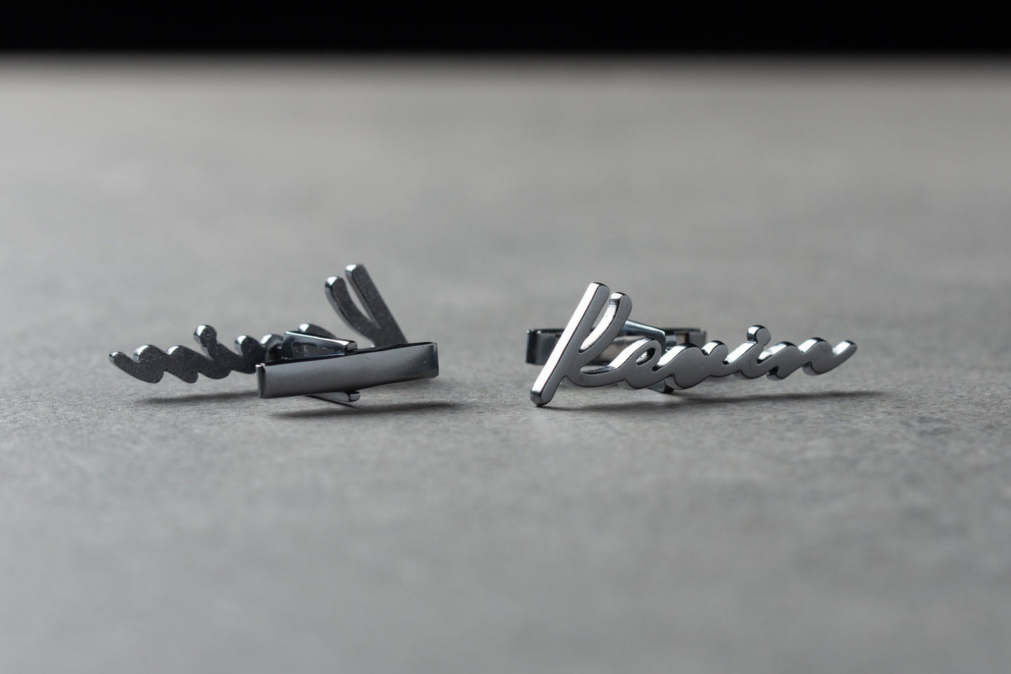 Close up of personalized handwritten style name cufflinks in gold finish