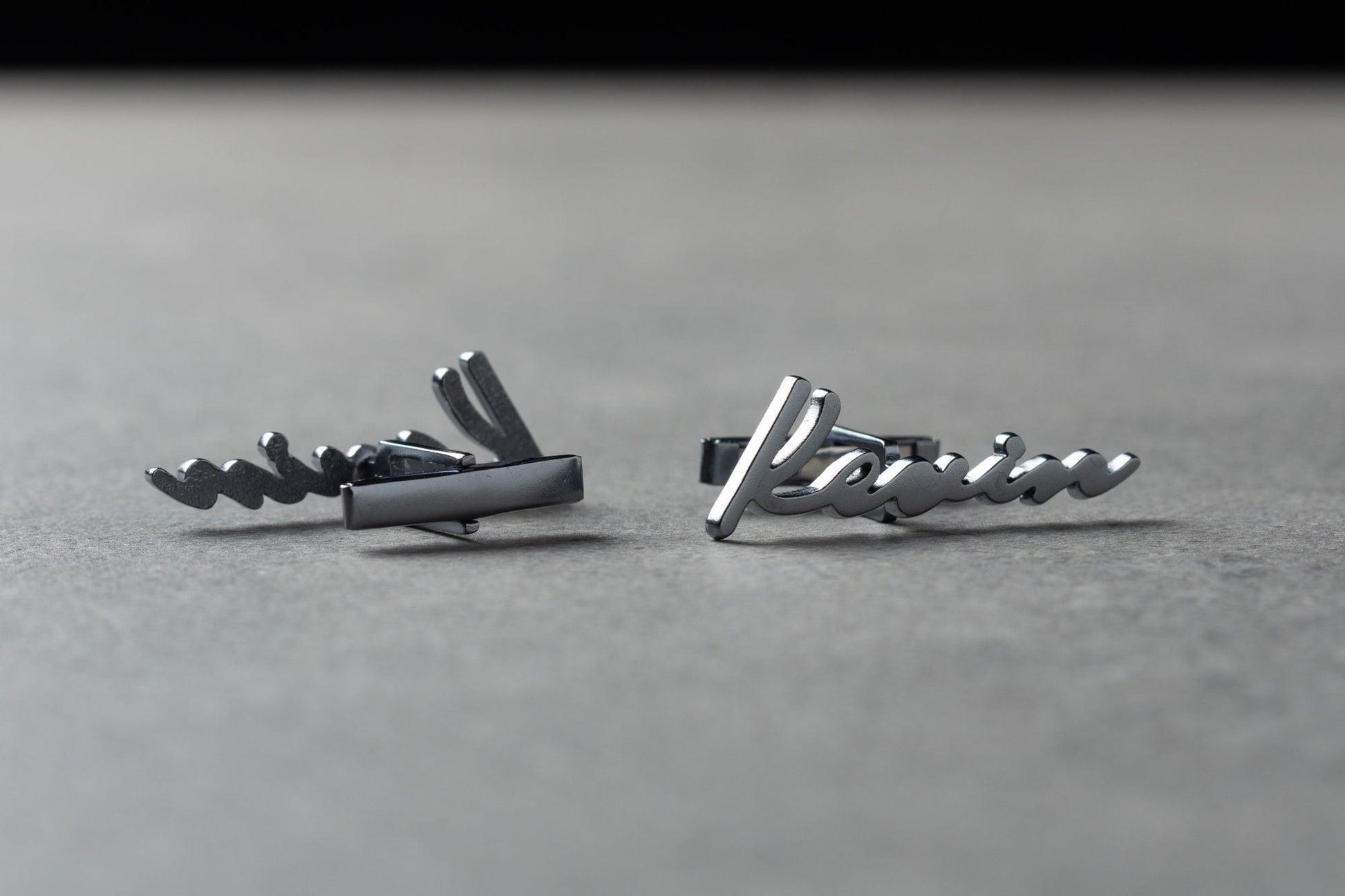Close up of personalized handwritten style name cufflinks in gold finish