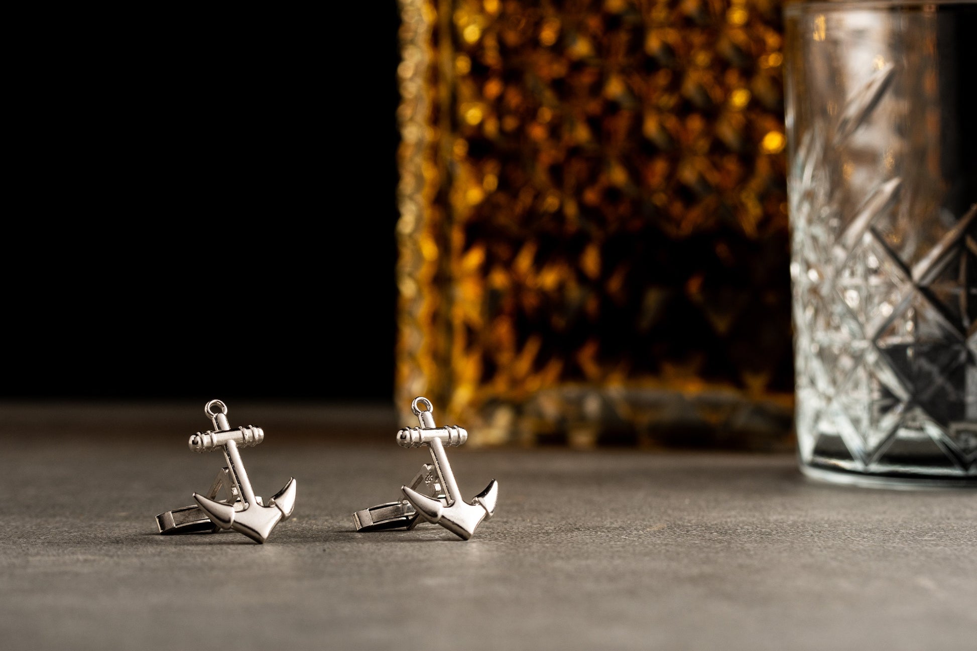 Close up of personalized 18k gold plated anchor cufflinks