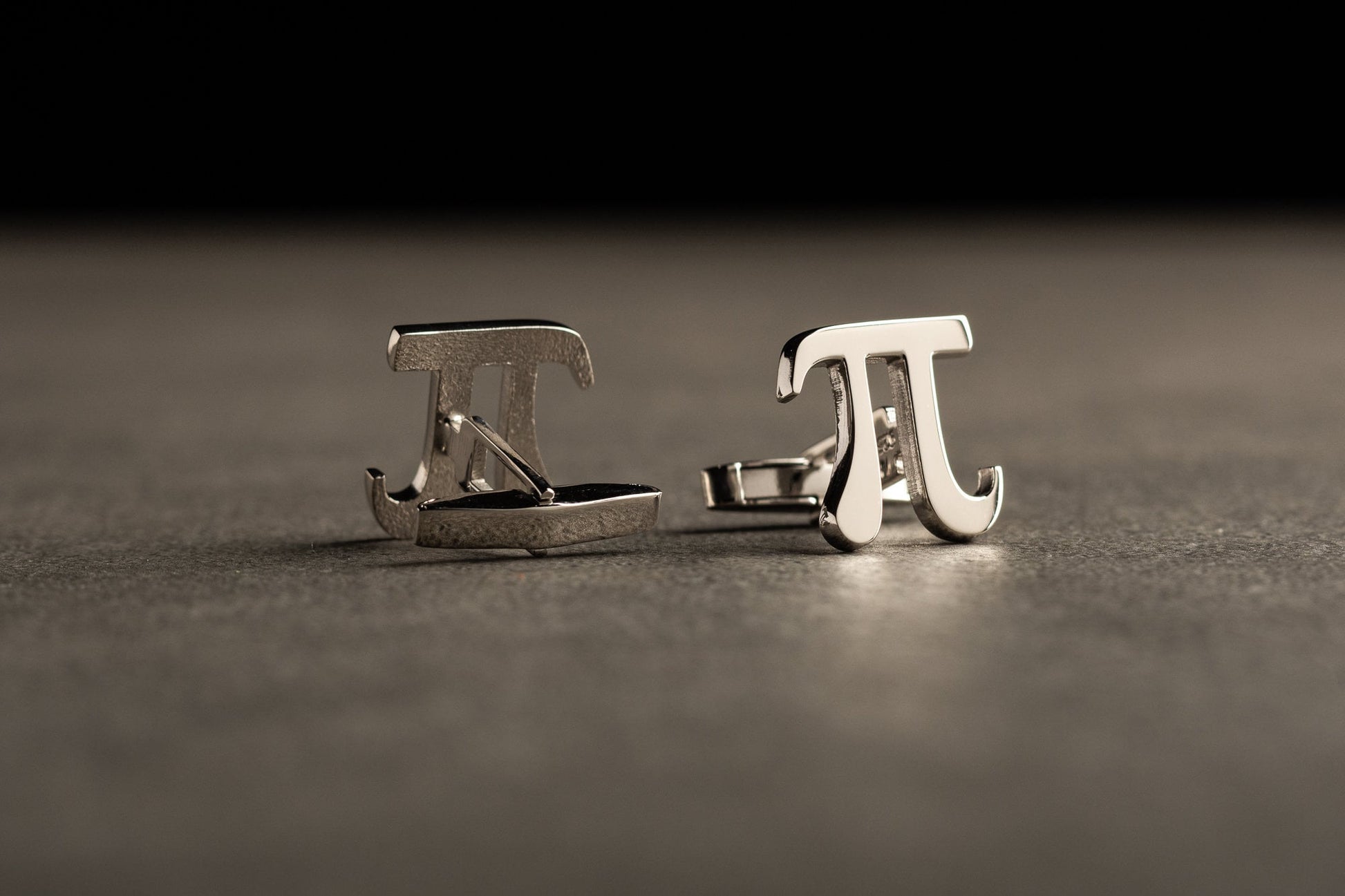 Close up of Pi symbol cufflinks in 18k gold vermeil finish